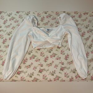 White long sleeve crop top with twisted front